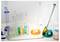 A laboratory setup with beakers and test tubes filled with various colored liquids, suggesting a chemistry experiment or lesson.