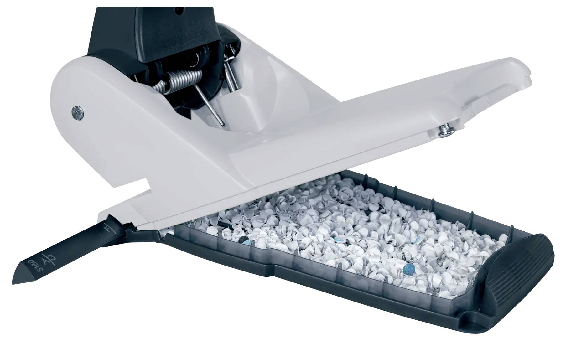 A paper shredder with its lid open showing shredded paper inside the bin.