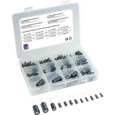An open plastic case with compartments, containing various sizes and types of capacitors. A label inside lists specifications.