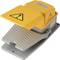 Industrial foot switch made of metal with yellow protective housing and warning symbols. Used for controlling machines through foot operation.