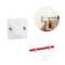 Wall-mounted cable organizer: a person uses a screwdriver for installation; holds cables in place with white plastic clips, two mounting screws visible.