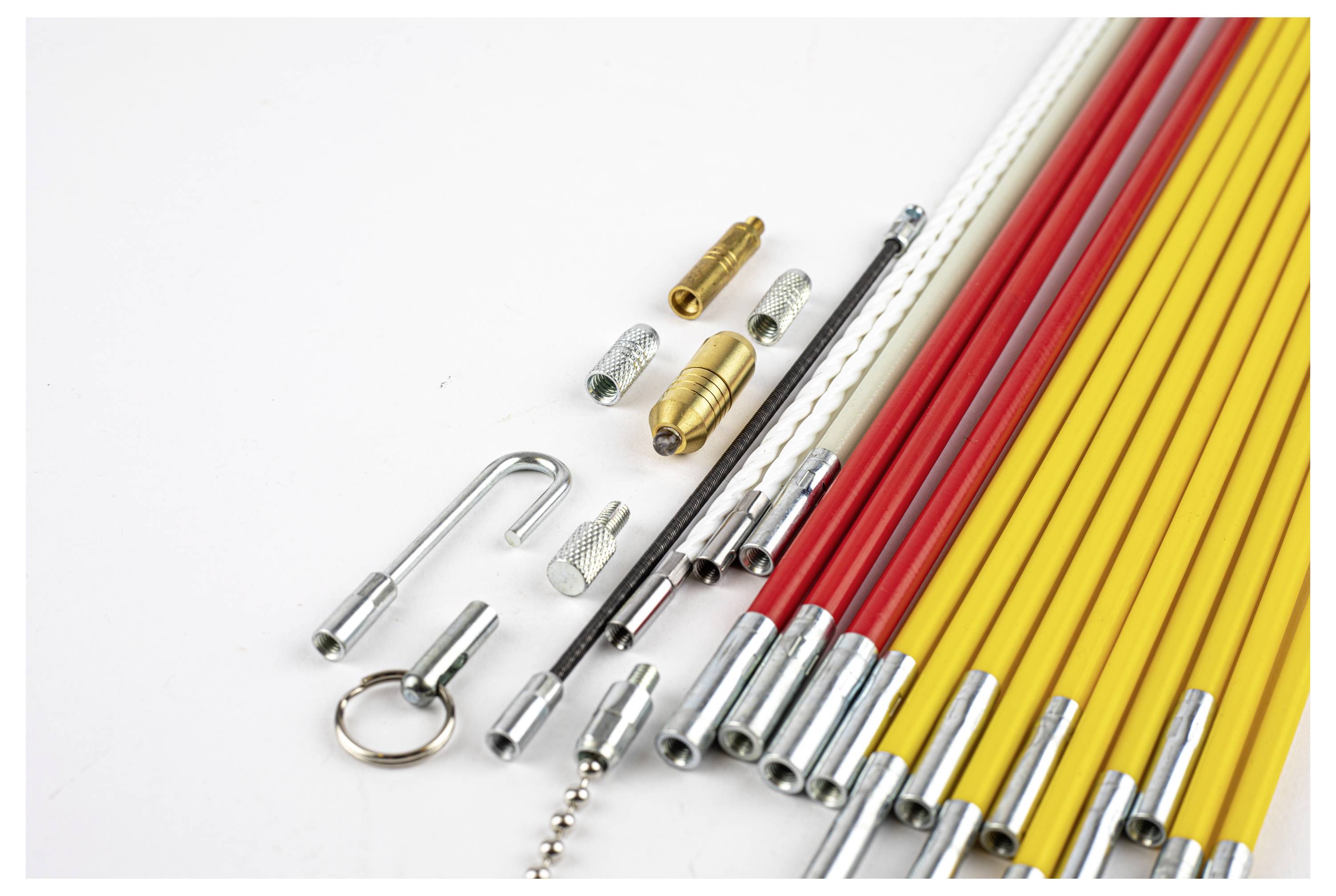 Various colourful cable pulling rods and tools used to guide cables through narrow spaces or pipes.