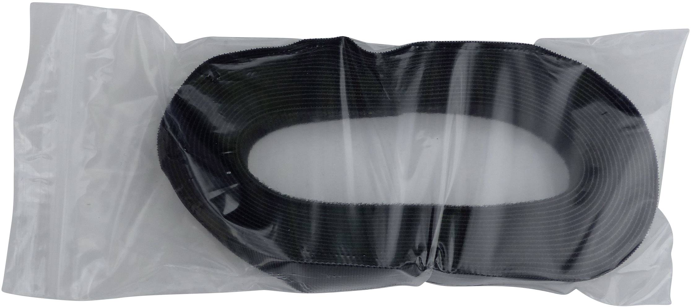 A black, spiral-shaped cable tie is lying in a transparent plastic bag.