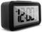 Digital clock displays '12:00 AM', with alarm set for '6:00 AM'. It also shows '1/1' and temperature '0.5°C'.