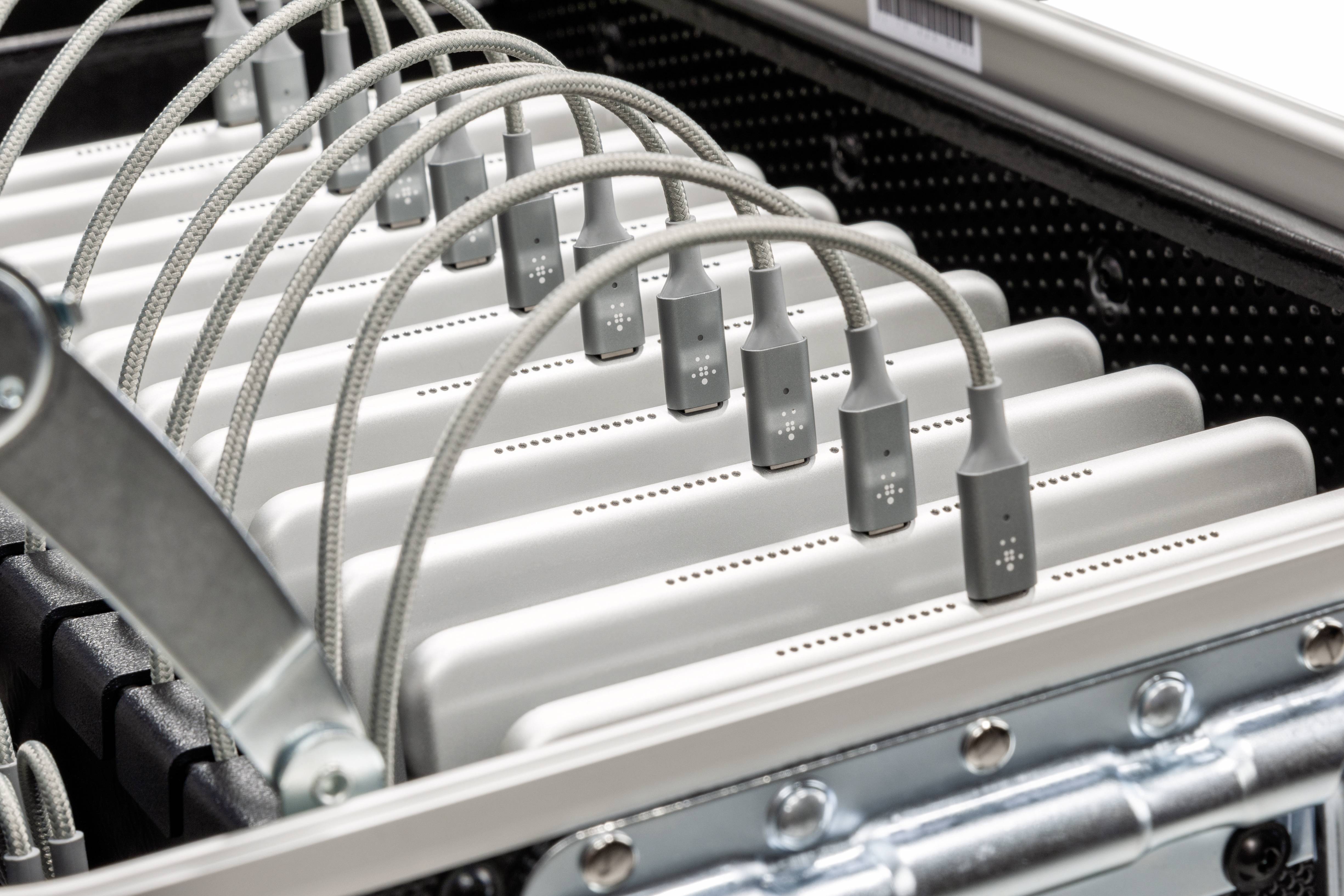 Several permanently installed, metallic chargers with cables in one device.