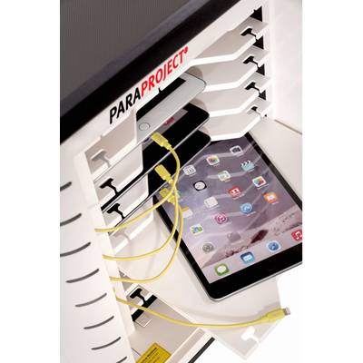 Tablet is being charged in a multi-slot charging and synchronisation station. Cables and charger visible.