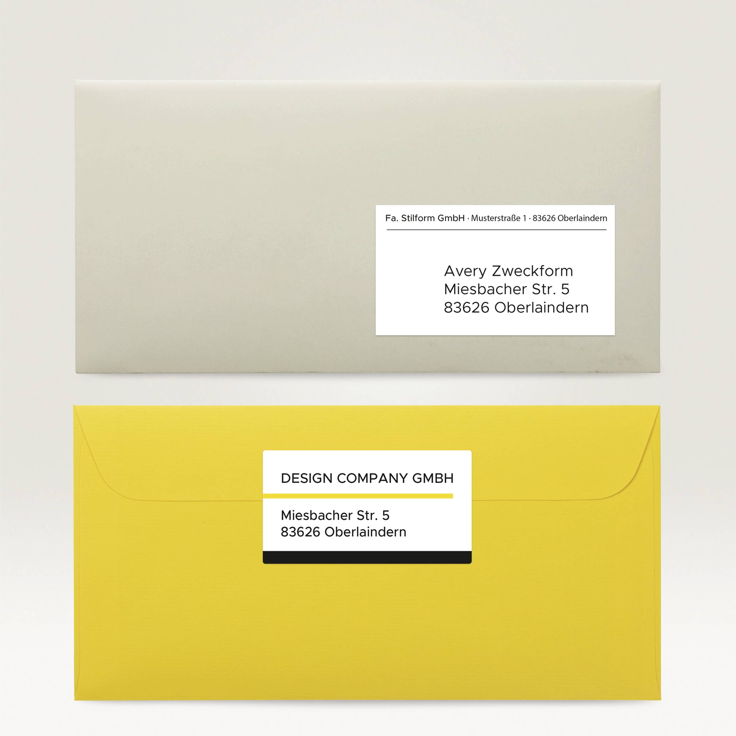 Two envelopes, one grey, one yellow. Both with address labels showing the address '5 Miesbach Street, 83626 Oberlaindern'.