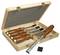 Wooden box with an open lid, containing five chisels with wooden handles and metal blades, arranged side by side.