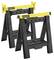 Two black and yellow Stanley workbenches standing side by side, ready for use as work support or carriers.
