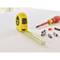 Yellow tape measure, red screwdrivers and screws nearby on a table, background blurred.