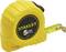 Yellow tape measure with 'Stanley 5m' printed on it, partially extended. Ideal for measuring longer distances.