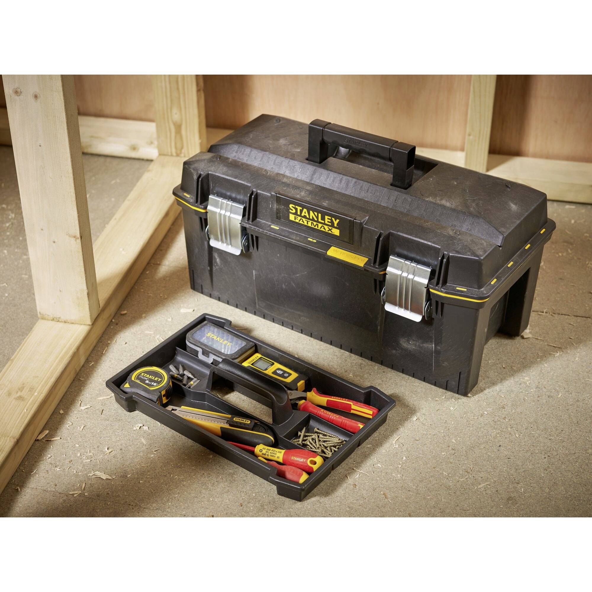 A black toolbox with silver locks and a removable compartment, filled with various tools and nails.