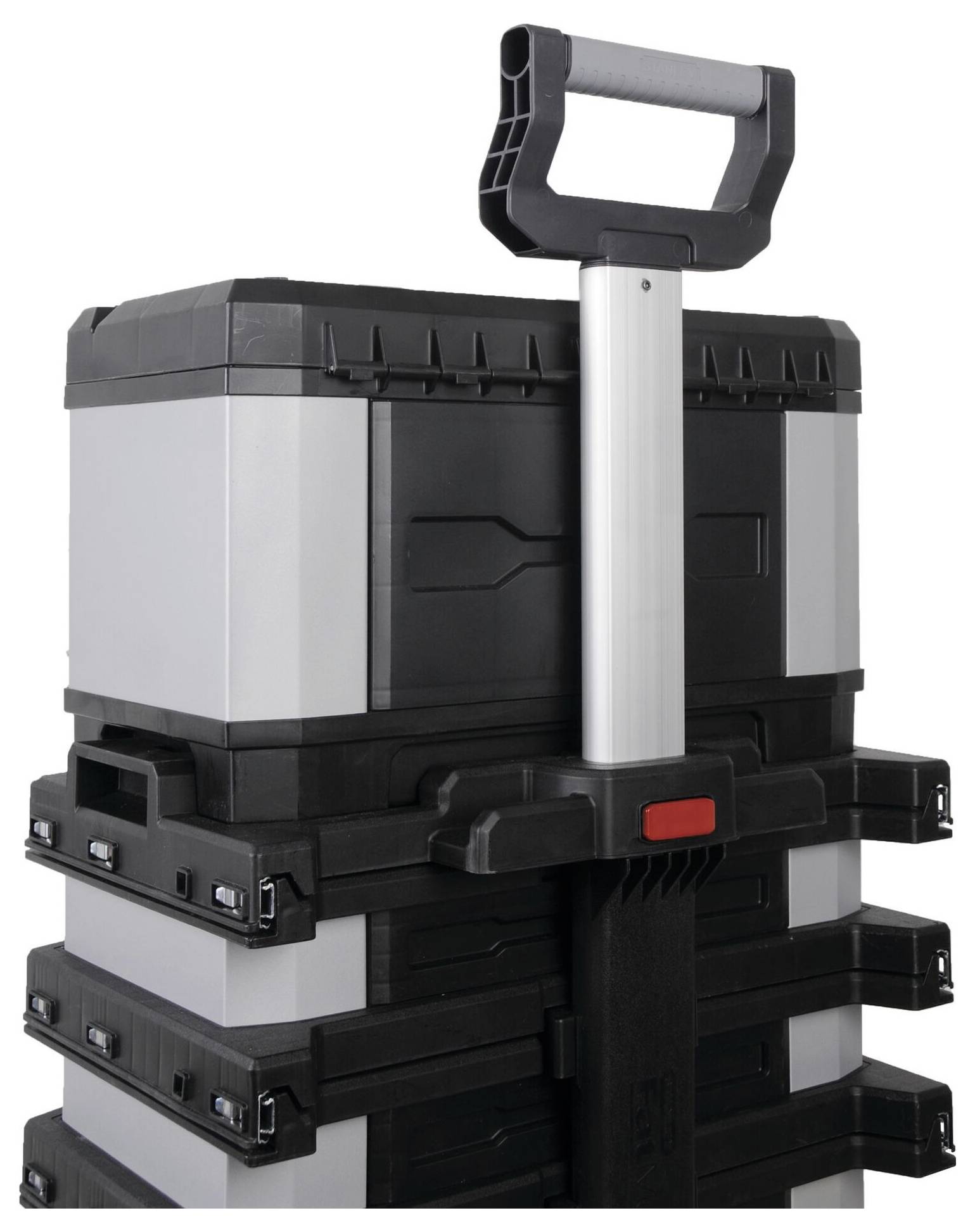 A stacked set of portable toolboxes with an extendable handle, ready for transportation.