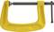 A yellow G-clamp for fixing or securing workpieces. It has an opening of 4 inches (100 mm).