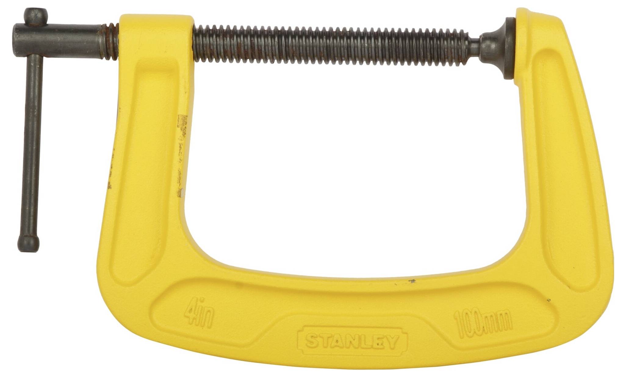 A yellow metal G-clamp made by Stanley, used for holding material in place during construction or DIY projects.