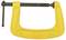 A yellow metal G-clamp made by Stanley, used for holding material in place during construction or DIY projects.