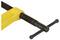 A yellow G-clamp with a black spindle and crossbar, ready to secure workpieces or materials.