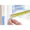 A hand is holding a tape measure positioned against a window frame. The scale shows a measurement in centimetres.