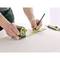 A person is measuring a wooden surface with an 8m measuring tape and marking a point with a pencil. Tools are lying nearby.