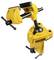 Yellow bench vice with black marking logo, mounted on an adjustable clamp, for holding workpieces at various angles.