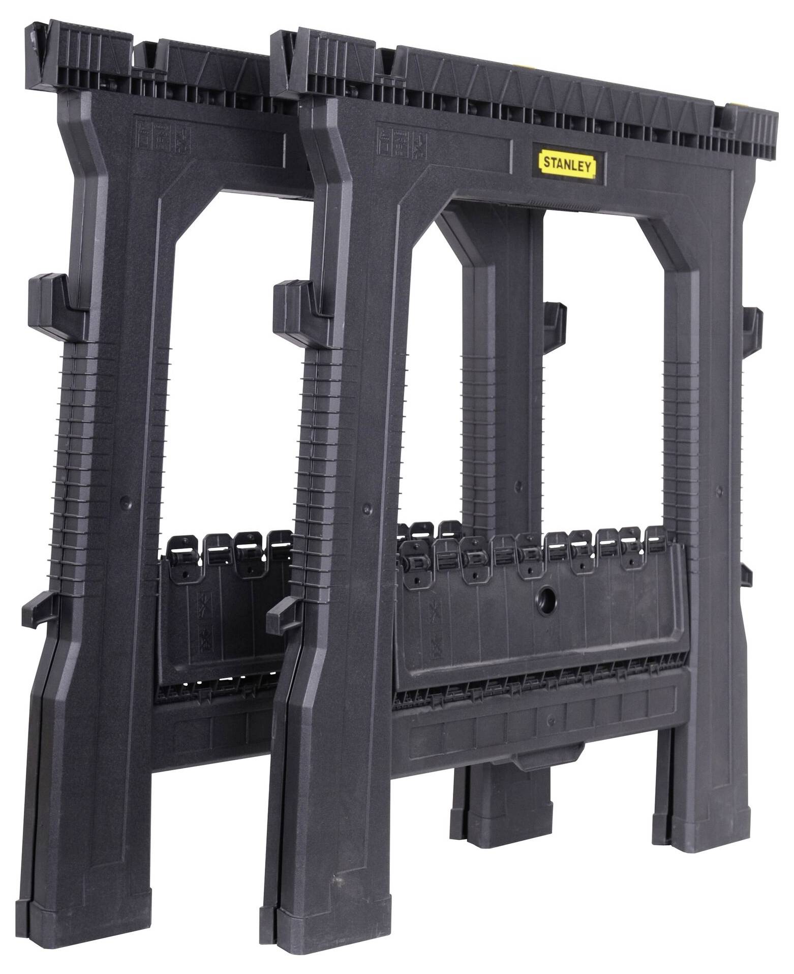 A black plastic Stanley saw horse with non-slip feet and an integrated tool storage compartment, suitable for workshop tasks.