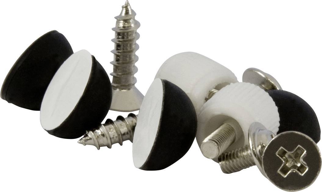 A collection of black and white furniture glides and screws is lying on a table. The glides are used to protect floors.