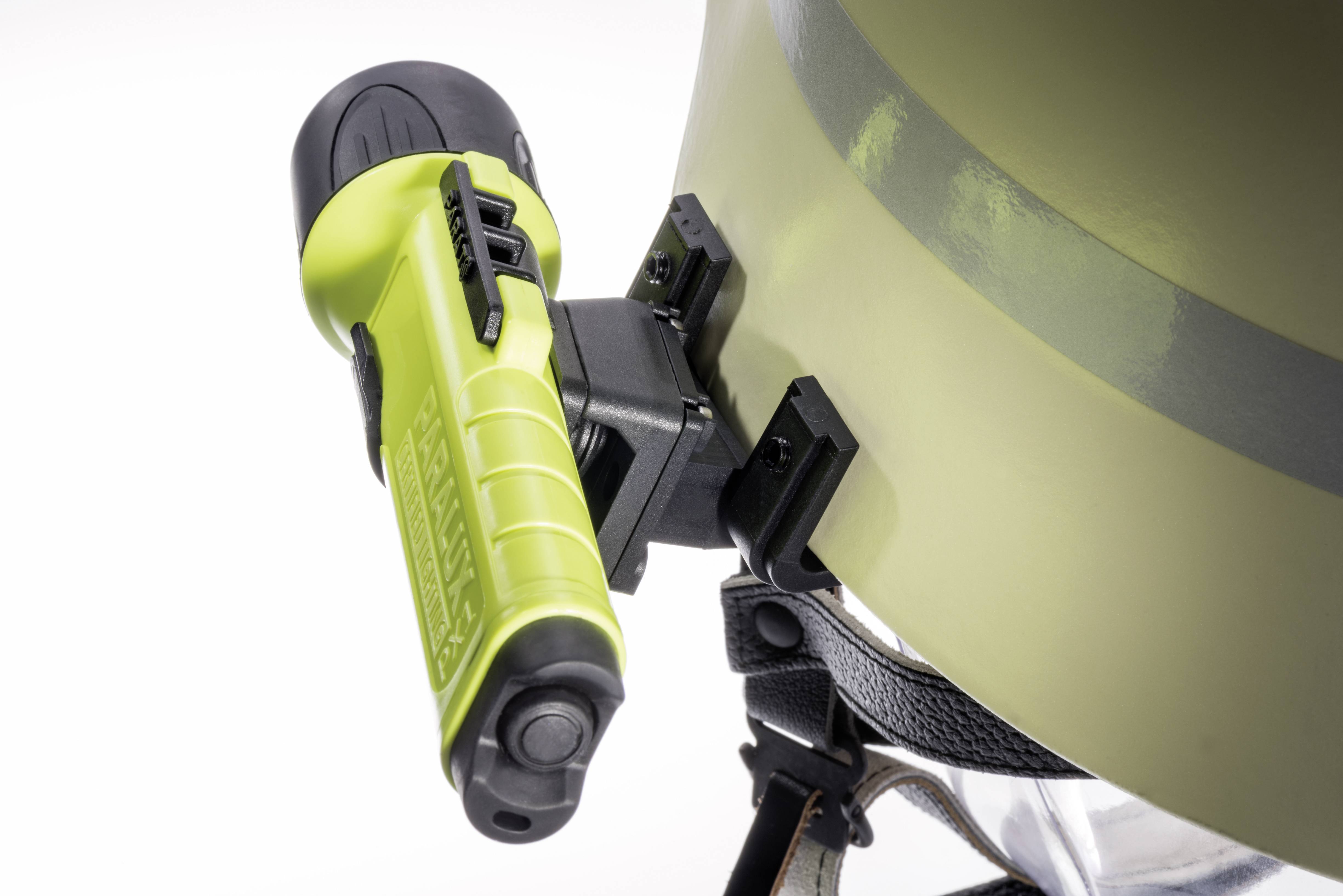 A green and black tool is attached to a light brown helmet. It is a safety device for securing purposes.