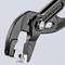 Hand tool, a black pipe wrench by Knipex, opened, with visible teeth and a label 'Knipex Cobra'.