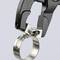Black bottle opener combined with a metal ring designed as a keychain.