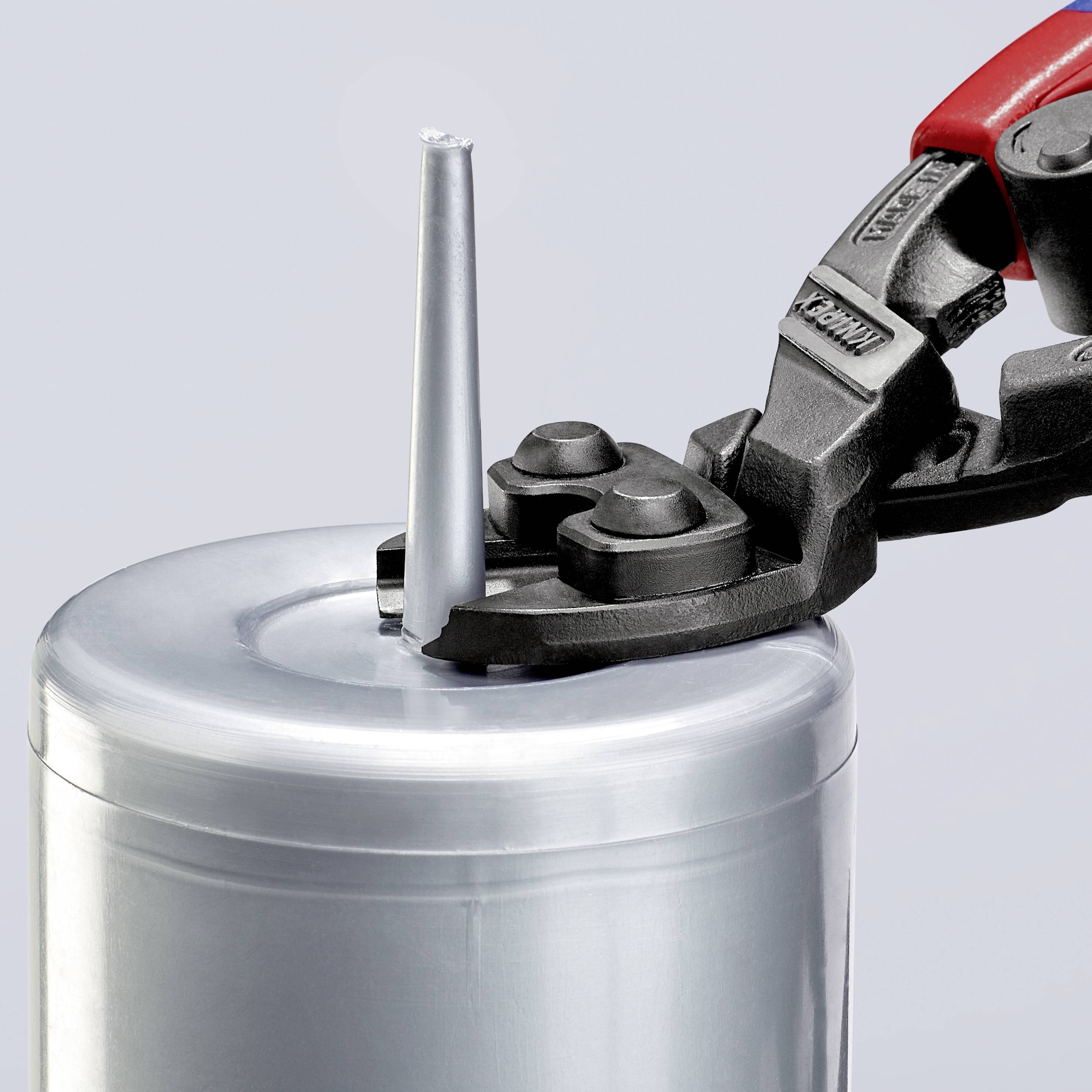 A red pair of scissors cuts the tip off a silver cartridge tube.