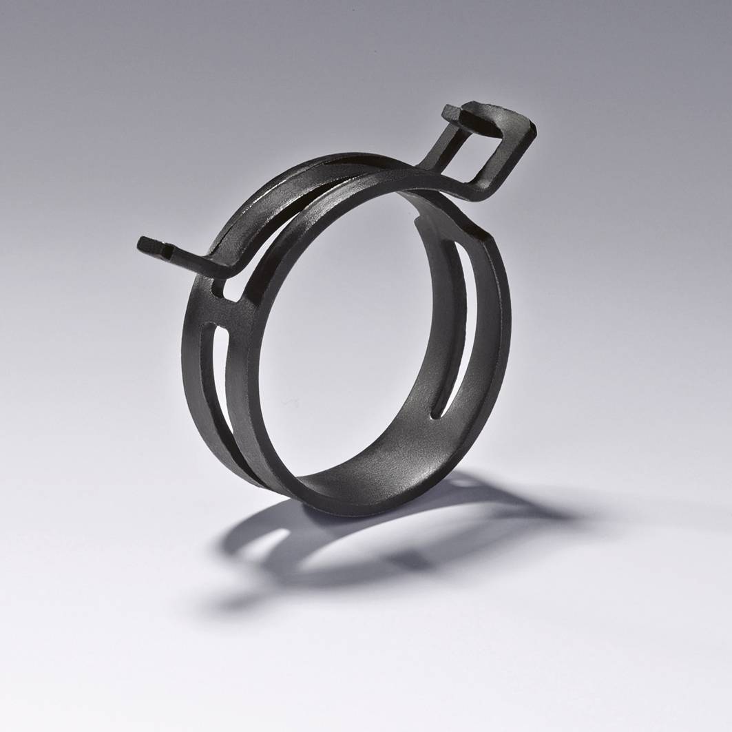 A silver metal clip for fastening or holding tubes or pipes, shown against a neutral background.