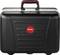 Black suitcase with red handle, central red logo with 'PARAT' lettering, rectangular shape, robust surface.