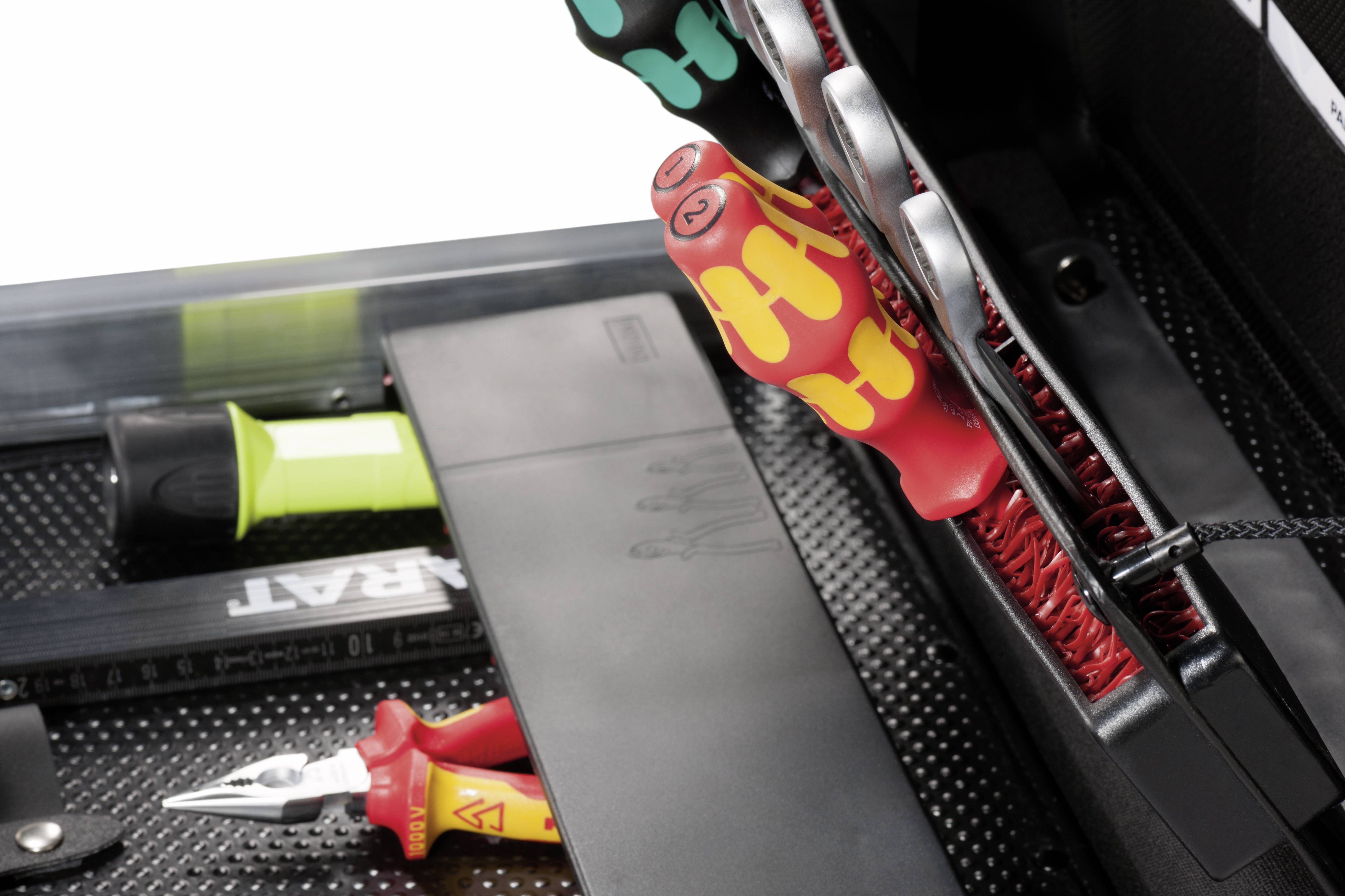 Toolbox with screwdrivers, pliers and ruler. Various tools neatly organised in a compartment for easy accessibility.