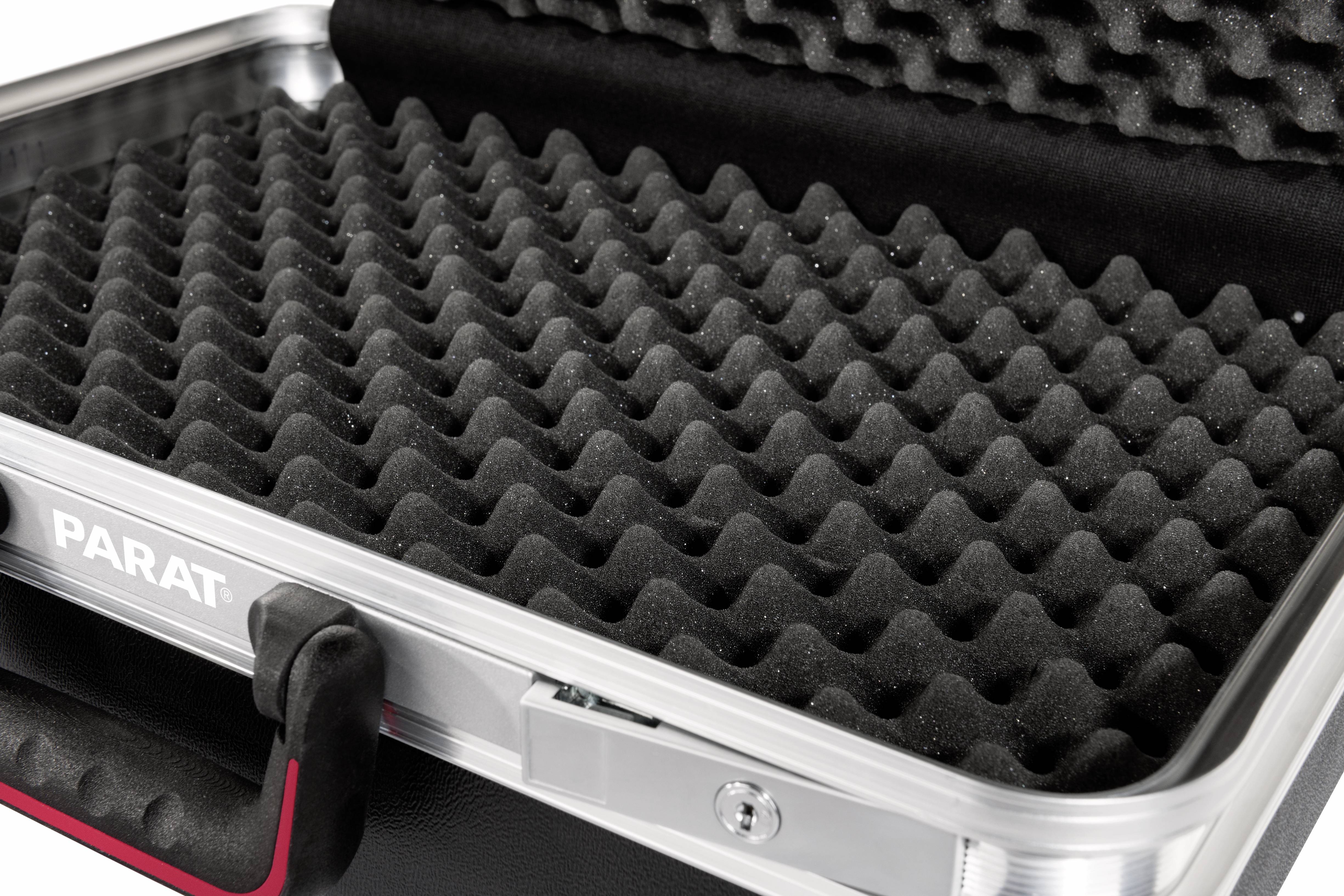 An opened suitcase with black foam for secure storage. The foam features a wavy pattern.