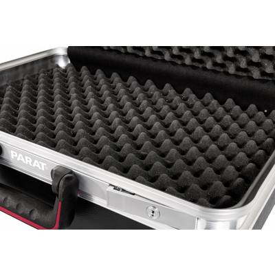 An opened suitcase with black foam for secure storage. The foam features a wavy pattern.