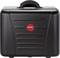 Black hard-shell suitcase with red 'PARAT' logo in the centre, carry handle on top, reinforced corners.