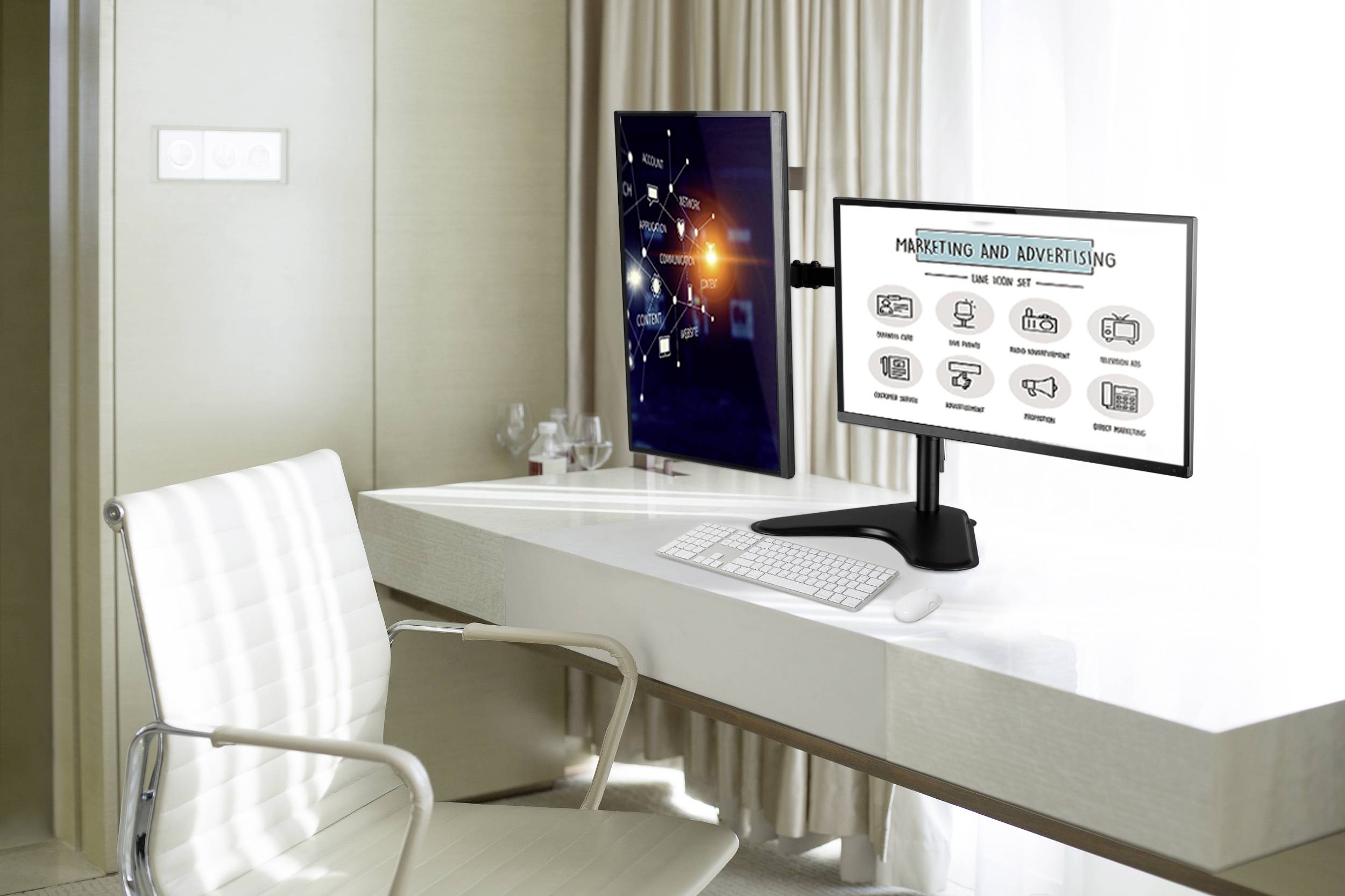 Modern workspace with two monitors on a white desk. On the left: diagram with digital symbols. On the right: infographic on 'Marketing and Advertising'.