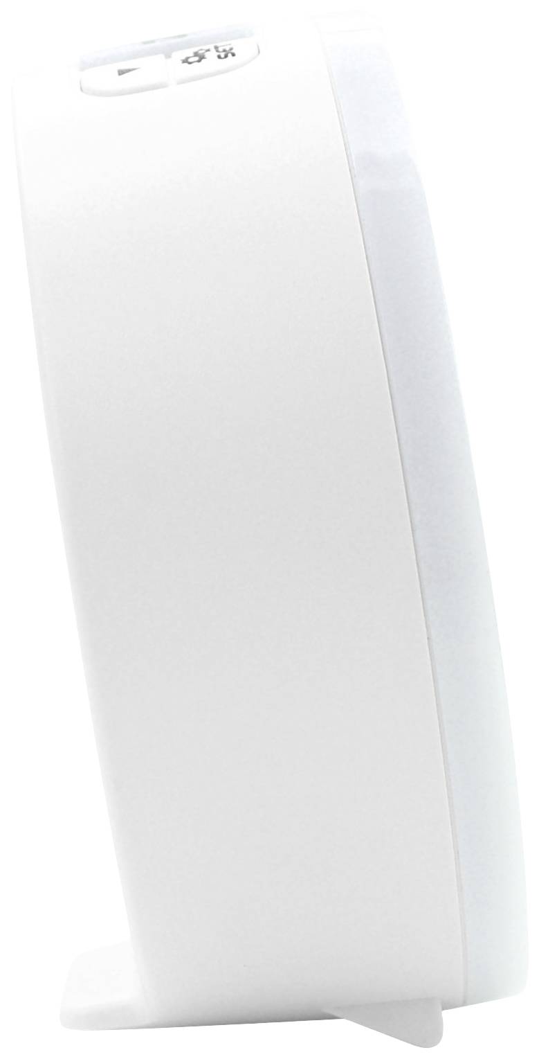 A white, oval device with a button on top, standing sideways on a table.