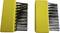 Two yellow brushes with black bristles, one on the left with shorter bristles, one on the right with longer, more densely arranged bristles.