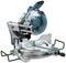 Mitre saw on a table, ready for use. It has a blue and silver design and is precisely suitable for woodworking.