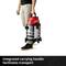 A person is holding a silver and red vacuum cleaner with an integrated carry handle. Text: 'Integrated carry handle makes transportation easier'.