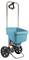 Blue spreader with black wheels and handle, ideal for evenly distributing seeds or fertiliser in the garden.