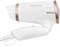 White hair dryer with copper-coloured details, 'PROFI CARE' lettering on the side. Compact design with foldable handle.