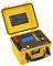 Yellow portable electronic measuring device with open lid and digital display. It shows connections and control elements on top.