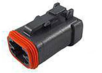 A black electrical connector with a red seal, used for connecting cables in technical equipment.