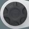 A circular black button labeled 'PUSH' with arrows indicating a rotating mechanism, set against a light gray background.