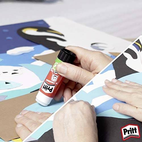 Person using a red Pritt glue stick to assemble a colorful paper collage.