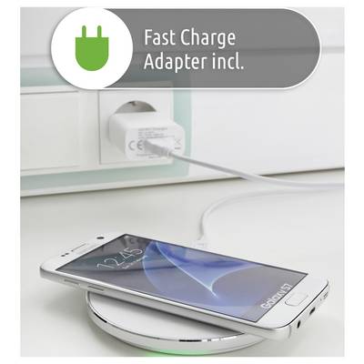 A smartphone is wirelessly charging on a pad. A power adapter is plugged into a wall outlet. A label reads 'Fast Charge Adapter incl.'.