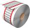 A large roll of paper or foil with printed labels and red markings. It is partially unrolled.