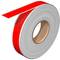 A roll of red adhesive tape, slightly unrolled.